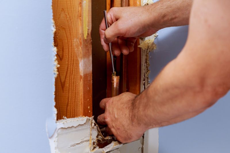 Plumber sealing a pipe joint